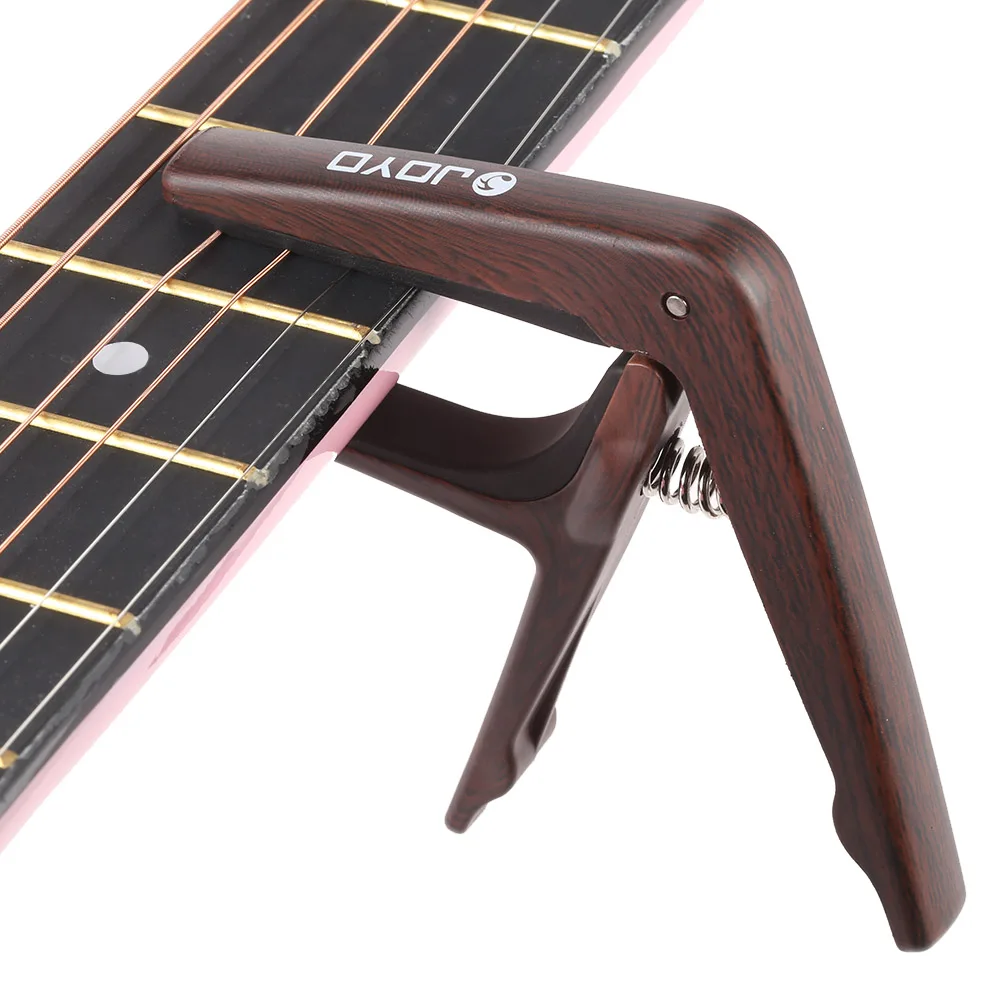 Null JOYO JCP-01 Light Guitar Capo Quick Change Clamp Key Plastic Steel with Guitar Pick for 6-String Acoustic Electric Guitar
Null JOYO JCP-01 Light Guitar Capo Quick Change Clamp Key Plastic Steel with Guitar Pick for 6-String Acoustic Electric Guitar