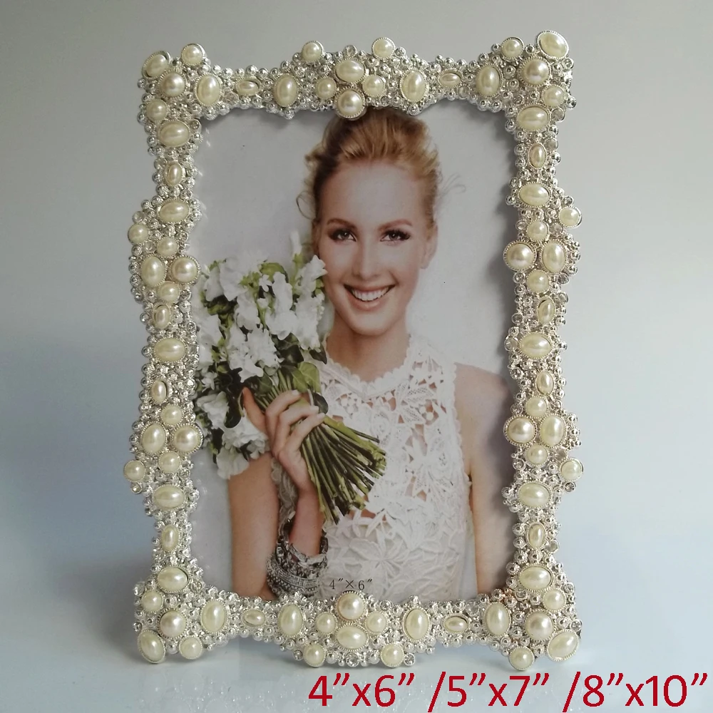 European Wedding Accents Shiny Silver Plating with White Pearls and Clear Rhinestone Jeweled 4x6,5x7,8x10 inch Metal Photo Frame
European Wedding Accents Shiny Silver Plating with White Pearls and Clear Rhinestone Jeweled 4x6,5x7,8x10 inch Metal Photo Frame