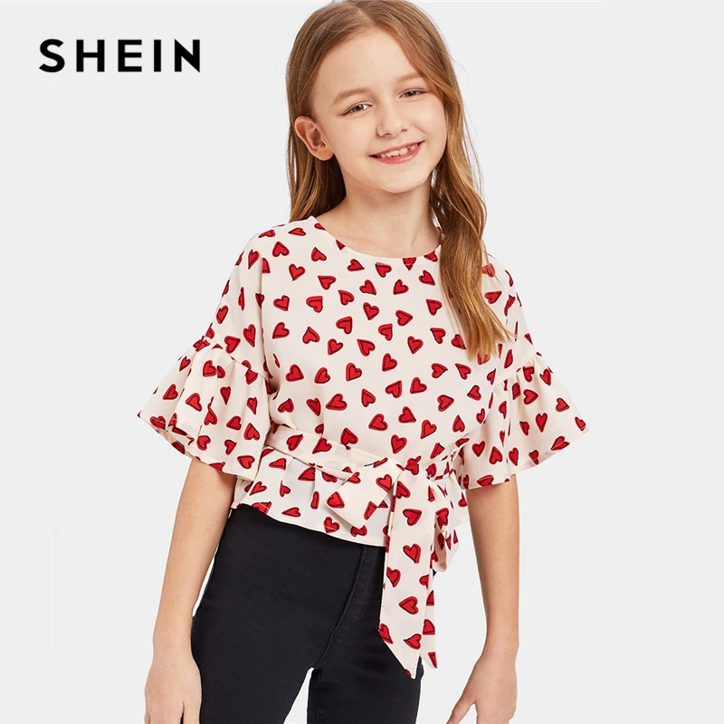 SHEIN Kiddie Hearts Print Girls Cute Blouse With Belt Kids Top 2019 Summer Korean Flounce Sleeve Asymmetrical Hem Casual Blouses
SHEIN Kiddie Hearts Print Girls Cute Blouse With Belt Kids Top 2019 Summer Korean Flounce Sleeve Asymmetrical Hem Casual Blouses