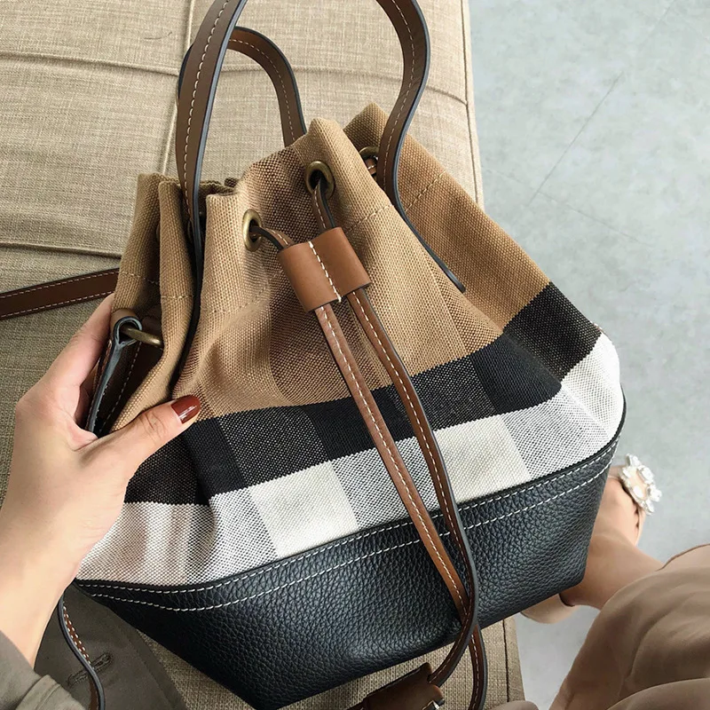 Women's Bag 2019 New Fashion Color Matching Check Canvas Bwith Bucket Shoulder Slung Portable Tide
Women's Bag 2019 New Fashion Color Matching Check Canvas Bwith Bucket Shoulder Slung Portable Tide