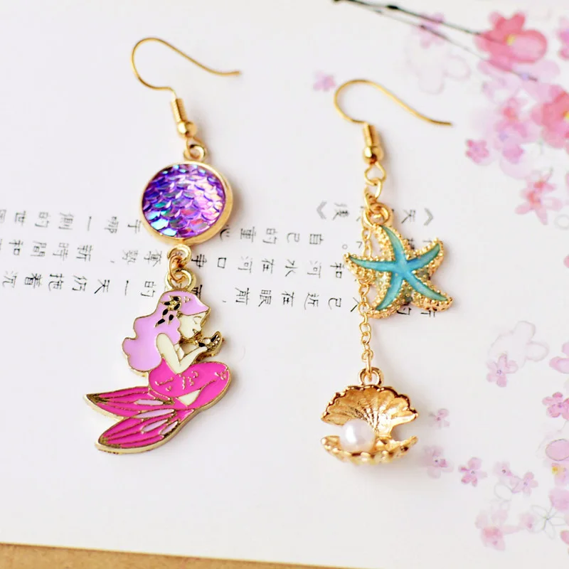 Cute Romantic Mermaid Starfish Sea Shell Charm Enamel Glaze Metal Asymmetry Drop Earrings Women Fashion Jewelry Accessory
Cute Romantic Mermaid Starfish Sea Shell Charm Enamel Glaze Metal Asymmetry Drop Earrings Women Fashion Jewelry Accessory