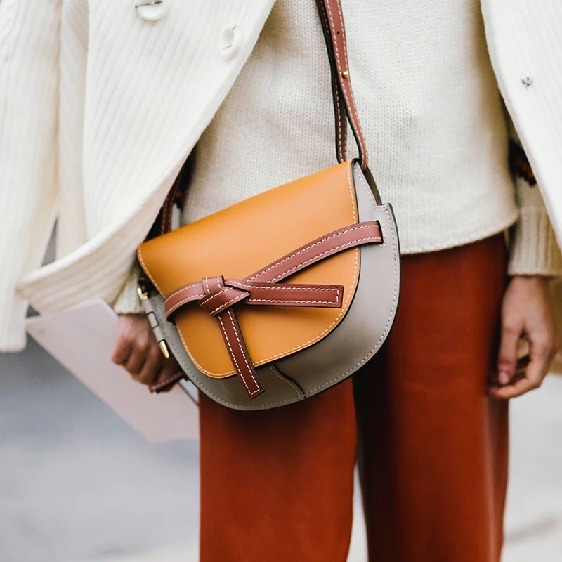 Fashion designer female high quality PU leather new spring and summer shoulder bag Messenger bag color matching bow half moon ba
Fashion designer female high quality PU leather new spring and summer shoulder bag Messenger bag color matching bow half moon ba