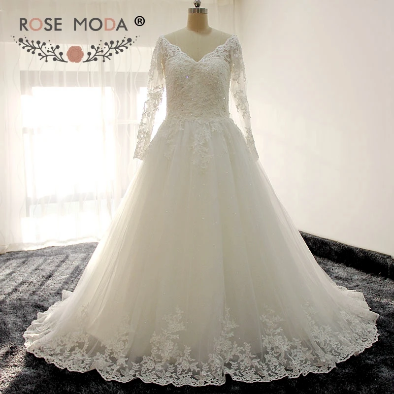 Rose Moda Long Sleeves V Neck Princess Lace Wedding Dress with Illusion Heart Shape Back Ball Gown
Rose Moda Long Sleeves V Neck Princess Lace Wedding Dress with Illusion Heart Shape Back Ball Gown