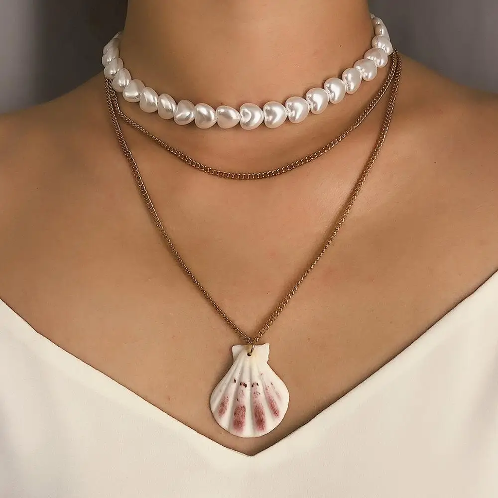 AOMU Bohemian Multi Layered Heart Pearl Choker Necklace Collar Statement Cowrie Shell Pendant Necklace For Women Jewelry
AOMU Bohemian Multi Layered Heart Pearl Choker Necklace Collar Statement Cowrie Shell Pendant Necklace For Women Jewelry