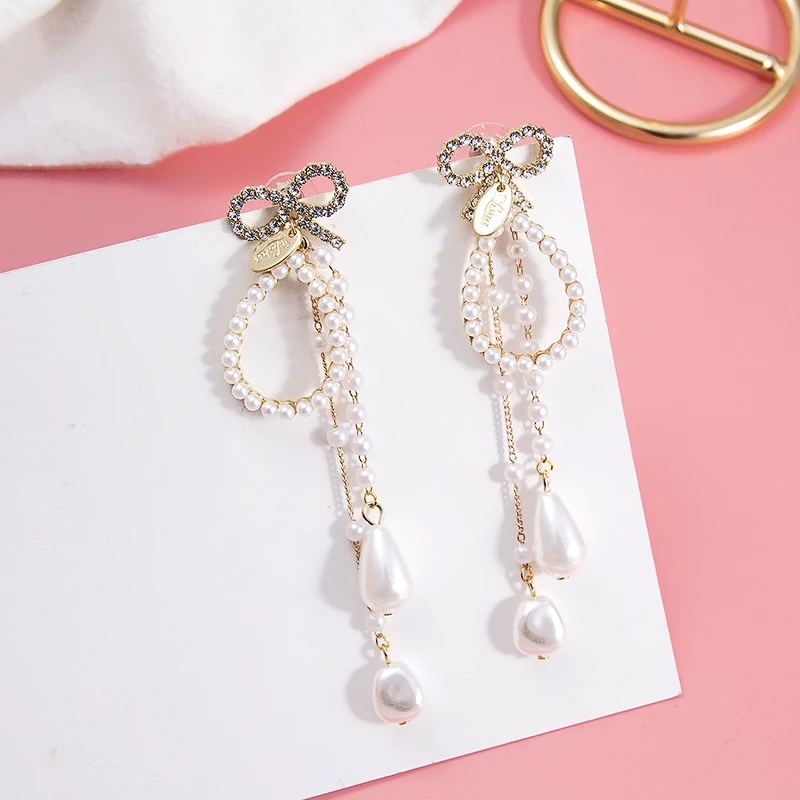 2019 Korean Trendy Bowknot Crystal Drop Earrings for Women Elegant Long Simulated Pearl Tassel Dangle Crystal Ear Jewelry 5C2014
2019 Korean Trendy Bowknot Crystal Drop Earrings for Women Elegant Long Simulated Pearl Tassel Dangle Crystal Ear Jewelry 5C2014