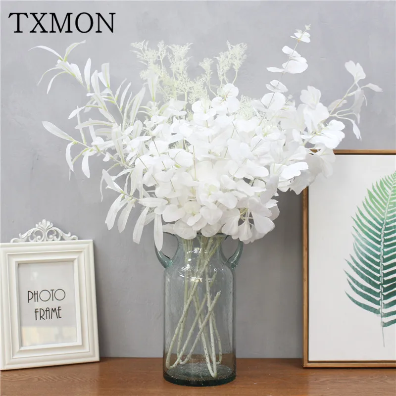 Simulation green plant fake leaves olive eucalyptus money leaf white wedding decoration plastic tree branch flower arrangement
Simulation green plant fake leaves olive eucalyptus money leaf white wedding decoration plastic tree branch flower arrangement