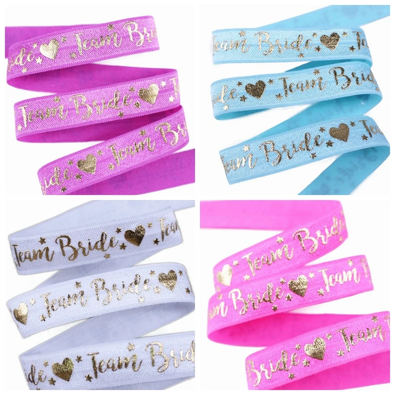 5/8" Gold foil Team Bride text heart star pattern FOE fold over elastic for wedding accessories welcome custom printed
5/8" Gold foil Team Bride text heart star pattern FOE fold over elastic for wedding accessories welcome custom printed