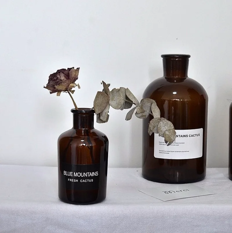 New Nodic modern Style European Pharmacy Bottle Shape with Letter Sticker Flower Pot Flower Vase Glass Bottle
New Nodic modern Style European Pharmacy Bottle Shape with Letter Sticker Flower Pot Flower Vase Glass Bottle