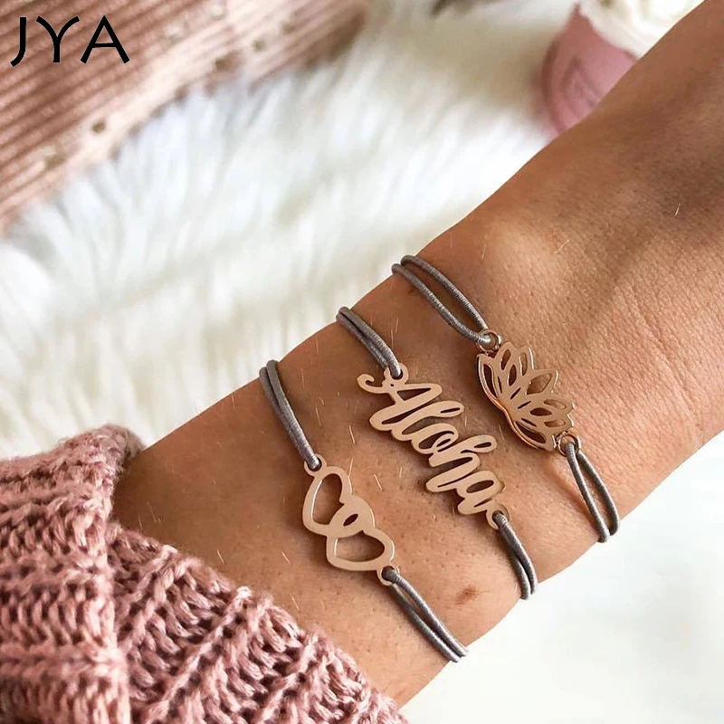 JYA Multi Layers Boho Bracelets for Women with Letters Lotus Hollow Golden Pendants Heart Charm Dangle Sets Grey Rope Simple
JYA Multi Layers Boho Bracelets for Women with Letters Lotus Hollow Golden Pendants Heart Charm Dangle Sets Grey Rope Simple