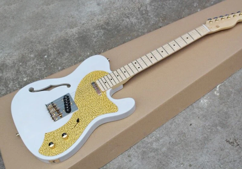White Semi-hollow Electric Guitar with Golden Pickguard,Maple Fingerboard,Gold Hardwares,offering customized services
White Semi-hollow Electric Guitar with Golden Pickguard,Maple Fingerboard,Gold Hardwares,offering customized services