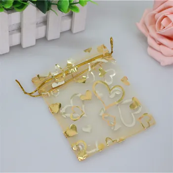 Wholesale 100pcs/lot 7*9cm Gold Christmas Plastic Bag With Heart Jewelry Gift Pouches Small Organza Bags
Wholesale 100pcs/lot 7*9cm Gold Christmas Plastic Bag With Heart Jewelry Gift Pouches Small Organza Bags