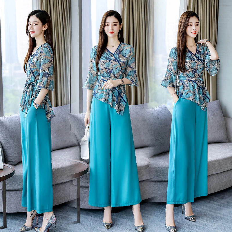 2019 Summer Women elegant two Piece Set floral chiffon blouse shirt Tops and wide leg pants trousers 2 piece suit
2019 Summer Women elegant two Piece Set floral chiffon blouse shirt Tops and wide leg pants trousers 2 piece suit