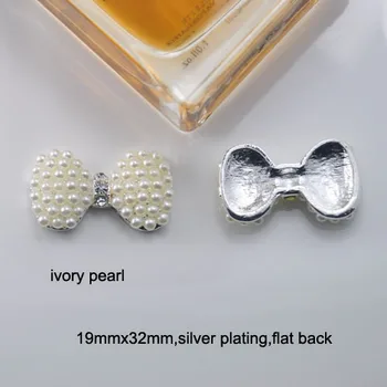 (M0723) 19mmx32mm rhinestone embellishment ,silver or light gold plating,all ivory pearls ,flat back ,bow shape
(M0723) 19mmx32mm rhinestone embellishment ,silver or light gold plating,all ivory pearls ,flat back ,bow shape