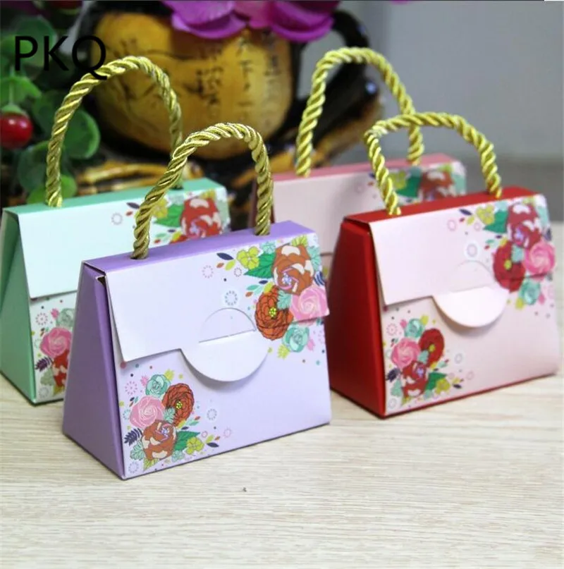 50pcs Flower Design Candy Box With Handle Wedding Favor Gift Boxes For Guest Small Sweet Candy Cookie Packing Box
50pcs Flower Design Candy Box With Handle Wedding Favor Gift Boxes For Guest Small Sweet Candy Cookie Packing Box