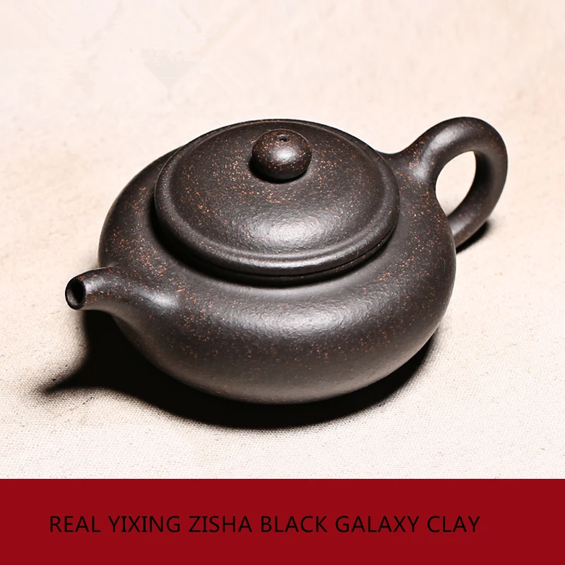 Chinese real yixing zisha black galaxy clay tea pot 180cc antique style pot of tea marked master teapot ball shaped infuse holes
Chinese real yixing zisha black galaxy clay tea pot 180cc antique style pot of tea marked master teapot ball shaped infuse holes