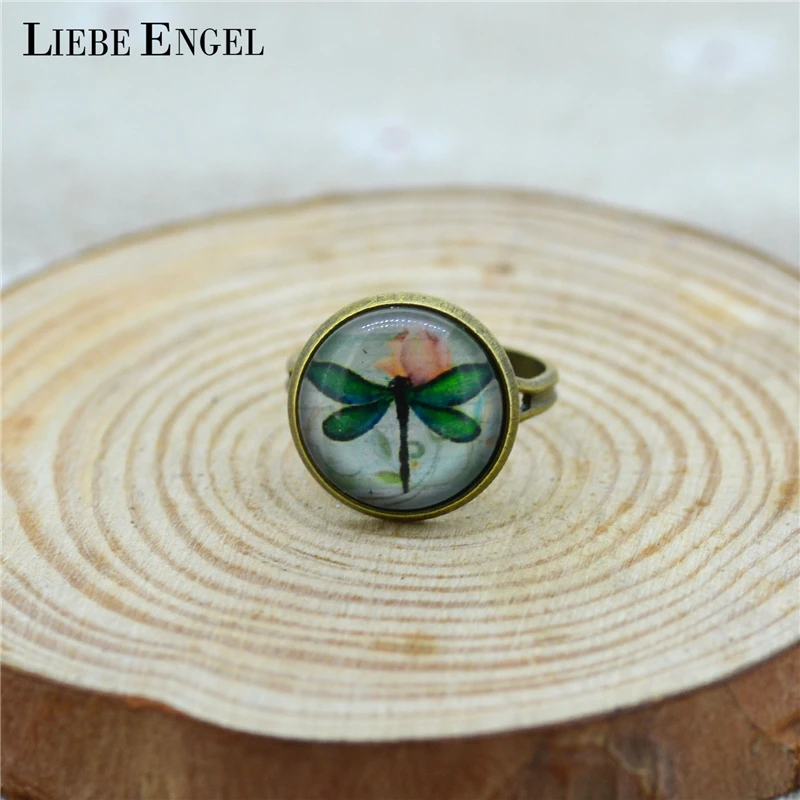 LIEBE ENGEL Vintage Glass Cabochon Dragonfly Ring Round Glass Dome Antique Bronze Copper Ring Bezel Setting For Women Adjustable
LIEBE ENGEL Vintage Glass Cabochon Dragonfly Ring Round Glass Dome Antique Bronze Copper Ring Bezel Setting For Women Adjustable