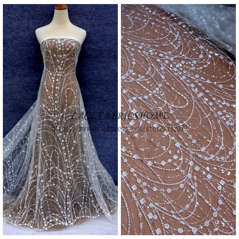 La Belleza Off white simple lines with clear shining sequins on netting embroidered wedding/brides/evening dress lace fabric
La Belleza Off white simple lines with clear shining sequins on netting embroidered wedding/brides/evening dress lace fabric