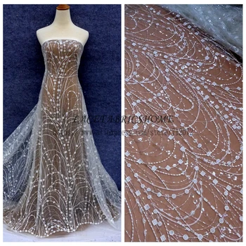La Belleza Off white simple lines with clear shining sequins on netting embroidered wedding/brides/evening dress lace fabric
La Belleza Off white simple lines with clear shining sequins on netting embroidered wedding/brides/evening dress lace fabric