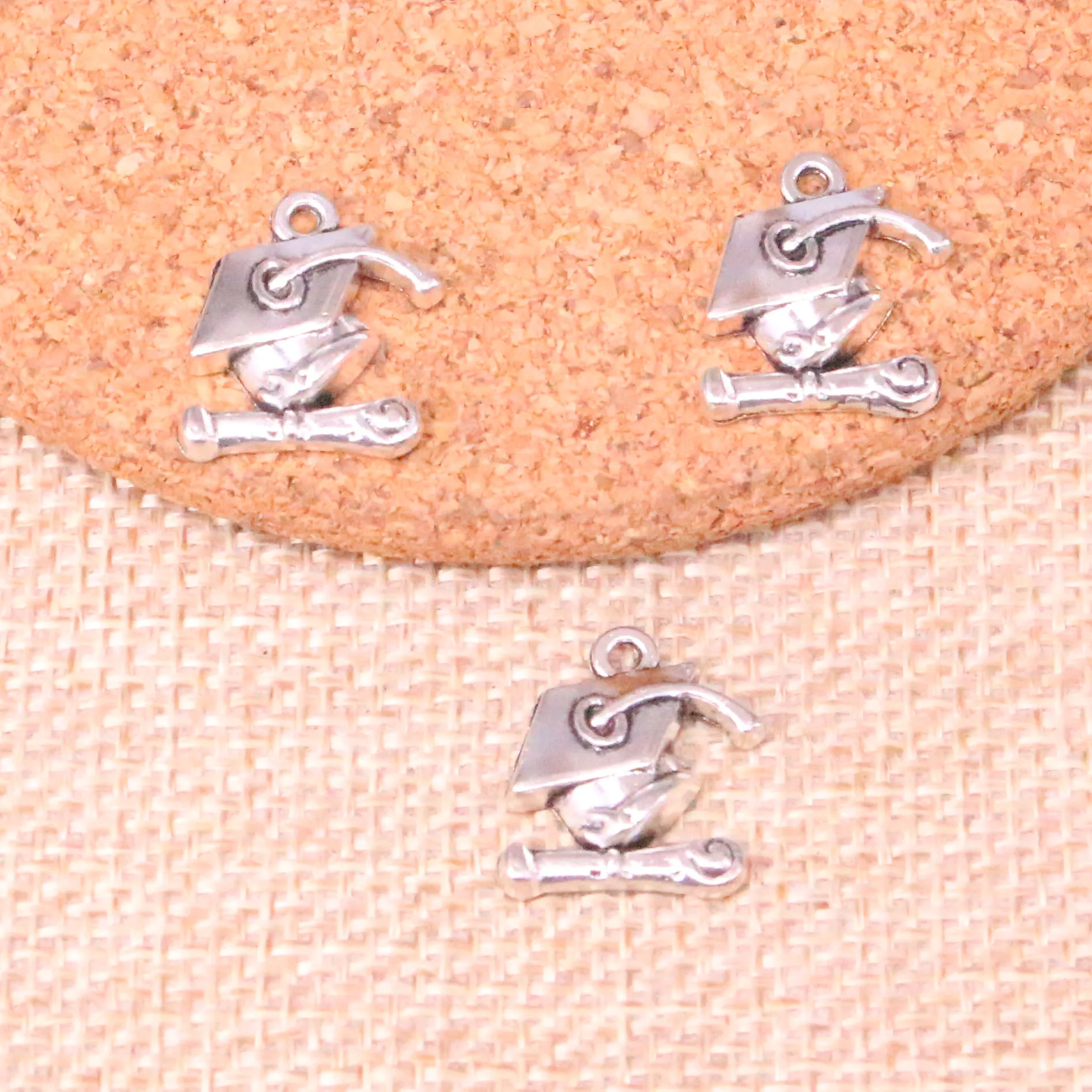 20pcs Tibetan Silver Plated graduation cap and diploma Charms Pendants for Jewelry Making DIY Handmade Craft 17*16mm
20pcs Tibetan Silver Plated graduation cap and diploma Charms Pendants for Jewelry Making DIY Handmade Craft 17*16mm