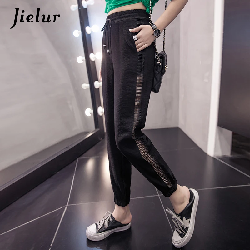 Jielur New Summer Thin Chiffon Pants Women Casual Street Harem Pants Side Hollow Mesh Black Capri Pantalon Femme Dropshipping
Jielur New Summer Thin Chiffon Pants Women Casual Street Harem Pants Side Hollow Mesh Black Capri Pantalon Femme Dropshipping
