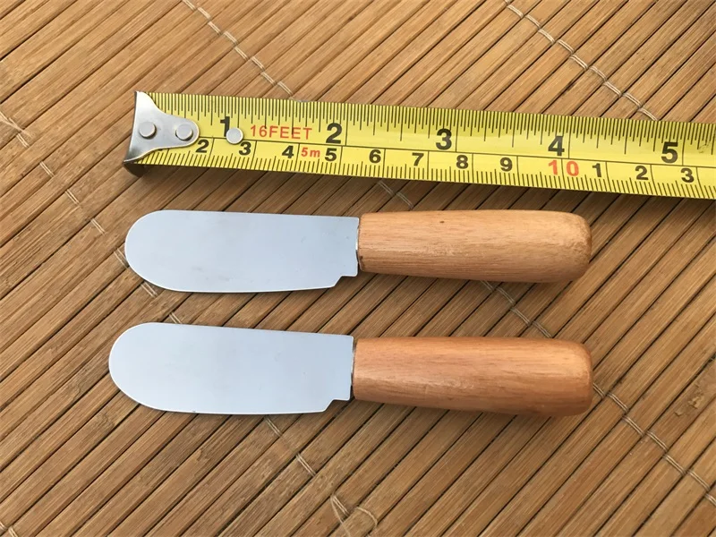 Stainless Steel Wooden Handle Butter Knife Butter Scraper Toast Scraper Multi Function Kitchen Dinner Tool New Arrivel
Stainless Steel Wooden Handle Butter Knife Butter Scraper Toast Scraper Multi Function Kitchen Dinner Tool New Arrivel