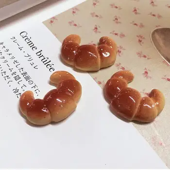 New arrival 50pcs/lot cute resin croissant bread Fake Faux food flat back kawaii cabochon for phone case decoration
New arrival 50pcs/lot cute resin croissant bread Fake Faux food flat back kawaii cabochon for phone case decoration