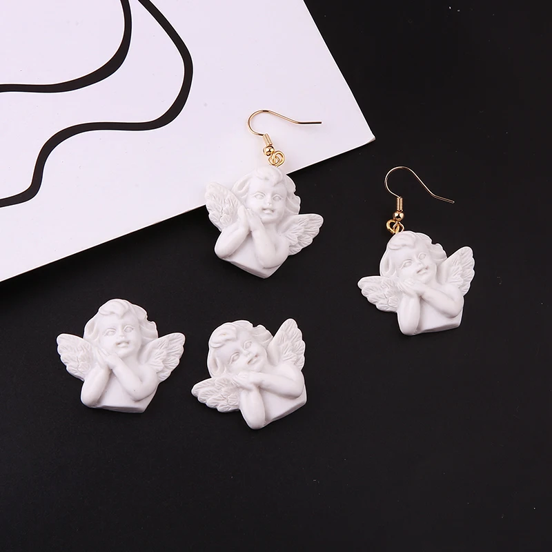 New Arrival 40pcs/lot White Resin Plastic Cute Angel Shape Jewelry Charms Ornament Accessories Plastic Necklace Pendants
New Arrival 40pcs/lot White Resin Plastic Cute Angel Shape Jewelry Charms Ornament Accessories Plastic Necklace Pendants