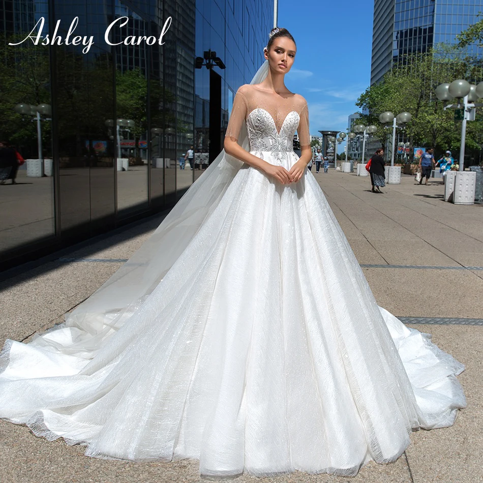 Ashley Carol Sexy Sweetheart Half Sleeve Illusion Princess Wedding Dress 2019 Luxury Crystal Beaded Court Train Wedding Gowns
Ashley Carol Sexy Sweetheart Half Sleeve Illusion Princess Wedding Dress 2019 Luxury Crystal Beaded Court Train Wedding Gowns