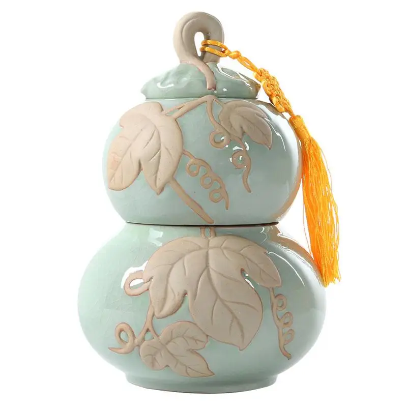 Chinese Gourd Shape Ceramic Tea Box Retro Leave Pattern Tea Storage Containers Green Home Porcelain Jar Powder Coffee Tea Can
Chinese Gourd Shape Ceramic Tea Box Retro Leave Pattern Tea Storage Containers Green Home Porcelain Jar Powder Coffee Tea Can