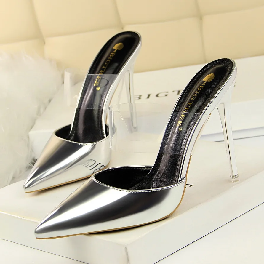 Simple metal heel slim stiletto shallow mouth pointed hollow transparent word belt high heel female slippers
Simple metal heel slim stiletto shallow mouth pointed hollow transparent word belt high heel female slippers