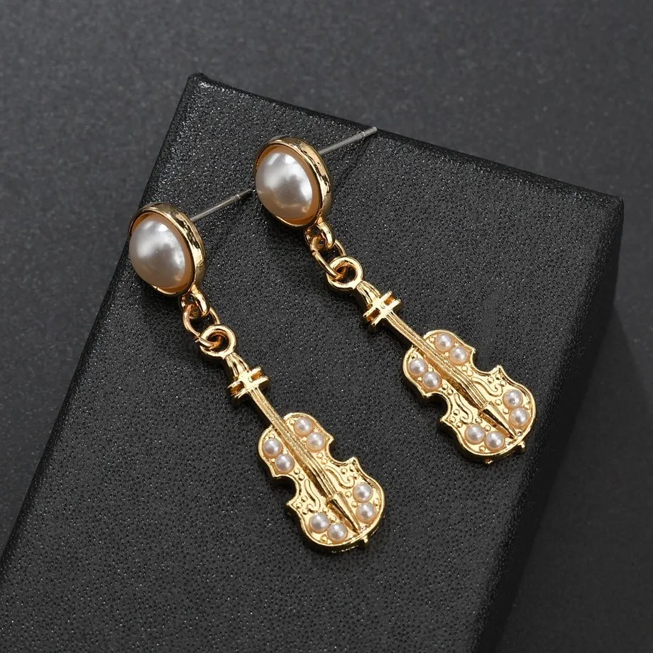 Violin Shape Pendant Earrings Creative Design Fun Musical Instrument Gold Earrings Sweet Elegant Romantic Female Holiday Gift
Violin Shape Pendant Earrings Creative Design Fun Musical Instrument Gold Earrings Sweet Elegant Romantic Female Holiday Gift