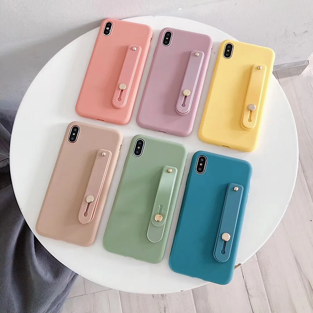 New simple candy color + wristband bracket protector for iphone 6 6s 7 8Plus X XR XS MAX feel comfortable soft TPU cover Coque
New simple candy color + wristband bracket protector for iphone 6 6s 7 8Plus X XR XS MAX feel comfortable soft TPU cover Coque