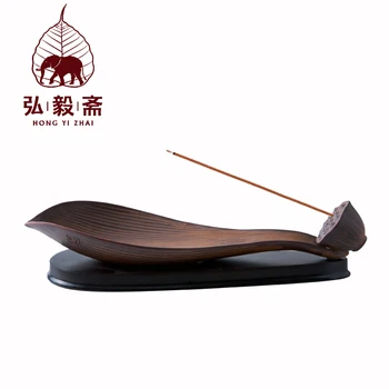 Yizhai tea imitation ancient lotus flowers inserted incense censer ceramic incense censer with horizontal wooden base
Yizhai tea imitation ancient lotus flowers inserted incense censer ceramic incense censer with horizontal wooden base