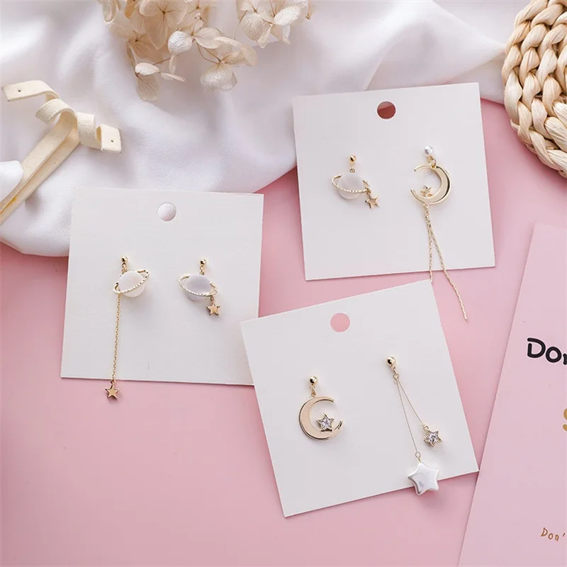Korea Temperament Pearl Shell Stars Moon Planet Asymmetric Pendant Earrings Trendy Temperament Female Earrings Jewelry Gift
Korea Temperament Pearl Shell Stars Moon Planet Asymmetric Pendant Earrings Trendy Temperament Female Earrings Jewelry Gift