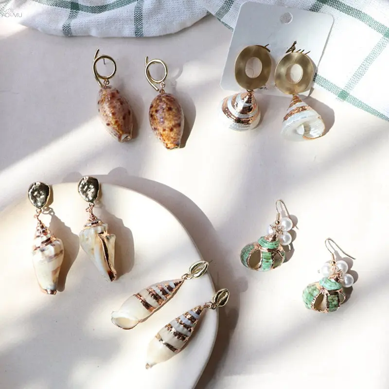 AOMU New Sea Shell Pendant Earrings Women Brincos Metal Imitiation Pearl Earrings Statement Gift Jewelry Bohemian Beach Jewelry
AOMU New Sea Shell Pendant Earrings Women Brincos Metal Imitiation Pearl Earrings Statement Gift Jewelry Bohemian Beach Jewelry