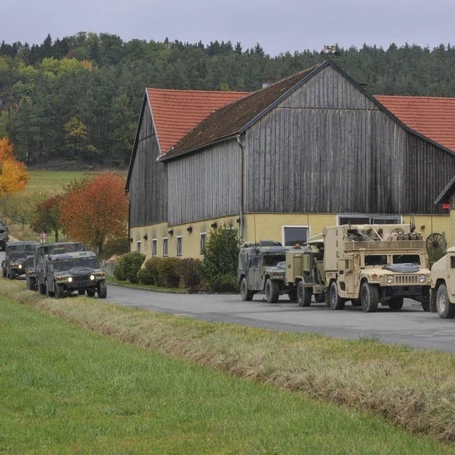 Convoy of U.S. Army vehicles in Amberg Germany Poster Print (34 x 22)