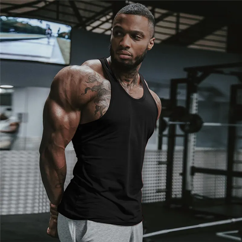 Men Solid Color Bodybuilding Stringer Gyms Tank Top Fitness Singlet Cotton Sleeveless Sport Shirt Muscle Fit Vest
Men Solid Color Bodybuilding Stringer Gyms Tank Top Fitness Singlet Cotton Sleeveless Sport Shirt Muscle Fit Vest