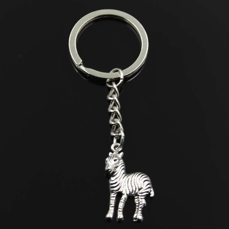 New Keychain 30x17mm zebra pinto Pendants DIY Men Car Key Chain Ring Holder Keyring Souvenir Jewelry Gift
New Keychain 30x17mm zebra pinto Pendants DIY Men Car Key Chain Ring Holder Keyring Souvenir Jewelry Gift
