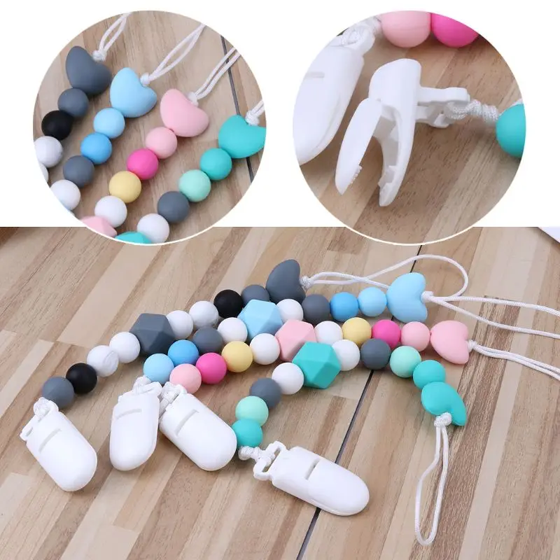 Silicone Pacifier Clip Wooden Bead Dummy Clip Holder Cute Pacifier Clips Soother Chains Baby Teething Toy for Baby Chew
Silicone Pacifier Clip Wooden Bead Dummy Clip Holder Cute Pacifier Clips Soother Chains Baby Teething Toy for Baby Chew