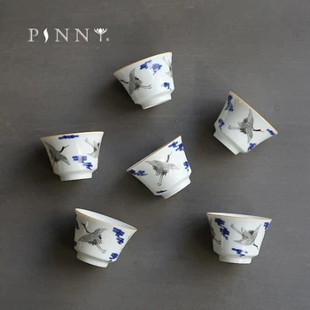 

PINNY Blue And White Porcelain Teacups Carved The Crane Ceramic Tea Cups Chinese Kung Fu Tea Service Hand Made Drinkware