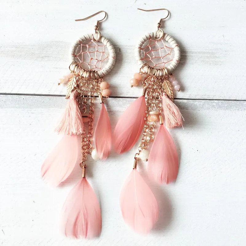 Handmade bohemian exaggerated fashion feather crystal braided long earrings ladies dream net Mother's Day gift
Handmade bohemian exaggerated fashion feather crystal braided long earrings ladies dream net Mother's Day gift