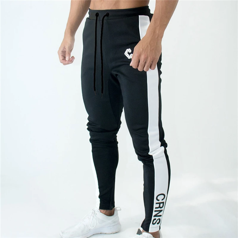 NEW GYMS Mens Joggers Pants Fitness Casual Fashion Brand Joggers Sweatpants Bottom Snapback Pants Men Stitching Casual Pants
NEW GYMS Mens Joggers Pants Fitness Casual Fashion Brand Joggers Sweatpants Bottom Snapback Pants Men Stitching Casual Pants