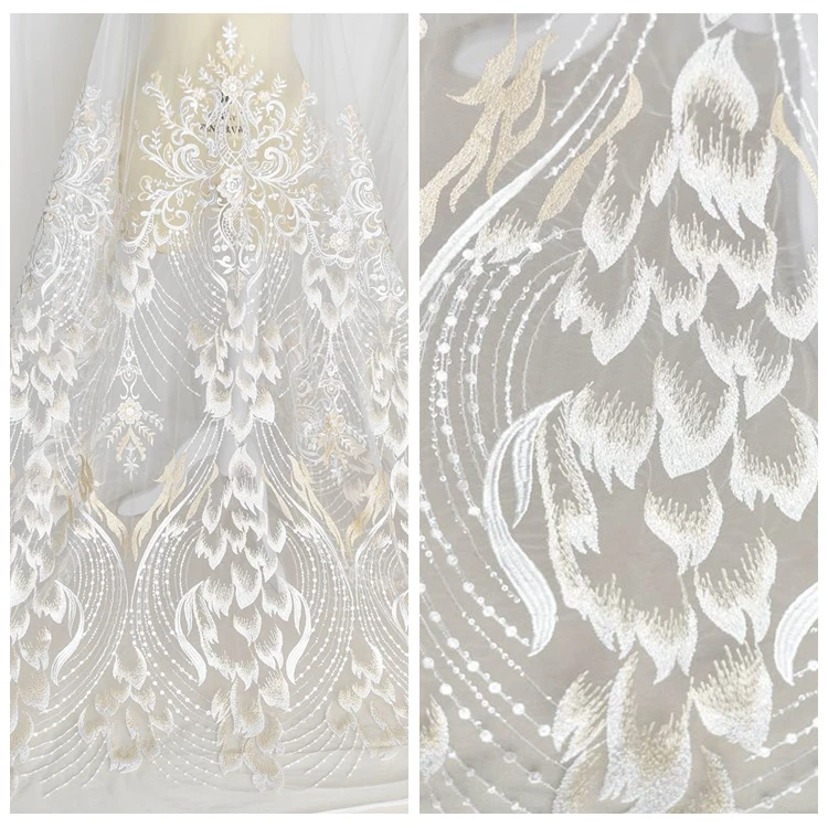 DIY High-quality white feather pattern sequnins Embroidery lace fabric Dress fabric Wedding cloth garment accessories
DIY High-quality white feather pattern sequnins Embroidery lace fabric Dress fabric Wedding cloth garment accessories