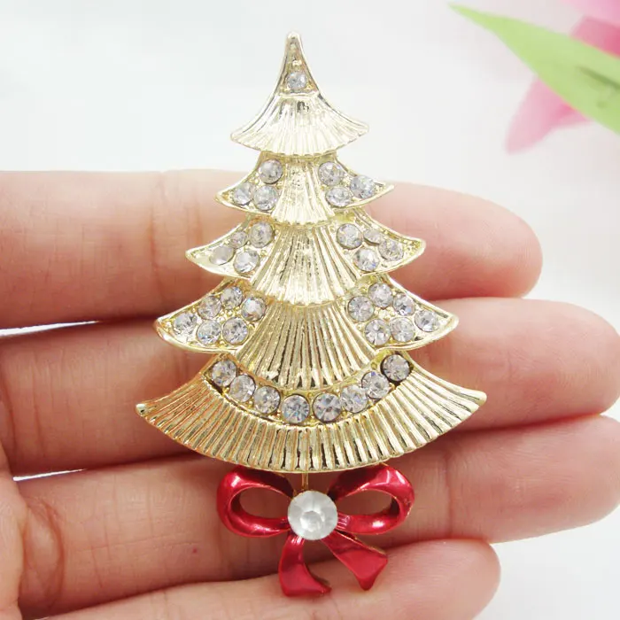 Фото Золотистая Рождественская елка с прозрачными австрийскими кристаллами модная