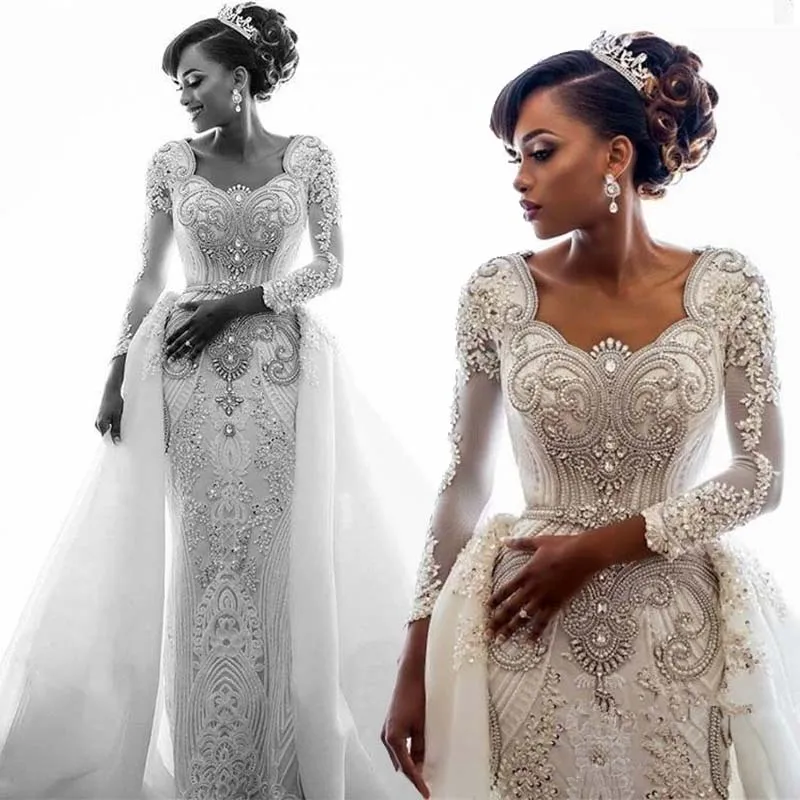 African Lace Mermaid Wedding Dress 2020 Long Sleeves Scoop Neck Beaded Crystals Over Skirts Court Train Wedding Bridal Gown
African Lace Mermaid Wedding Dress 2020 Long Sleeves Scoop Neck Beaded Crystals Over Skirts Court Train Wedding Bridal Gown