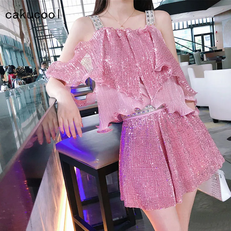 Cakucool New Bing Womens Set Sequines Beading Spaghetti Off Shoulder Ruffles Top Mini Skirt Luxury Beach Party Suit 2pcs set
Cakucool New Bing Womens Set Sequines Beading Spaghetti Off Shoulder Ruffles Top Mini Skirt Luxury Beach Party Suit 2pcs set
