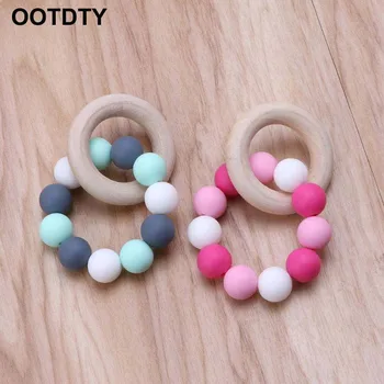 Baby Nursing Bracelets Wooden Teether Silicone Chew Beads Teething Rattles Toys Teether Montessori Bracelets
Baby Nursing Bracelets Wooden Teether Silicone Chew Beads Teething Rattles Toys Teether Montessori Bracelets