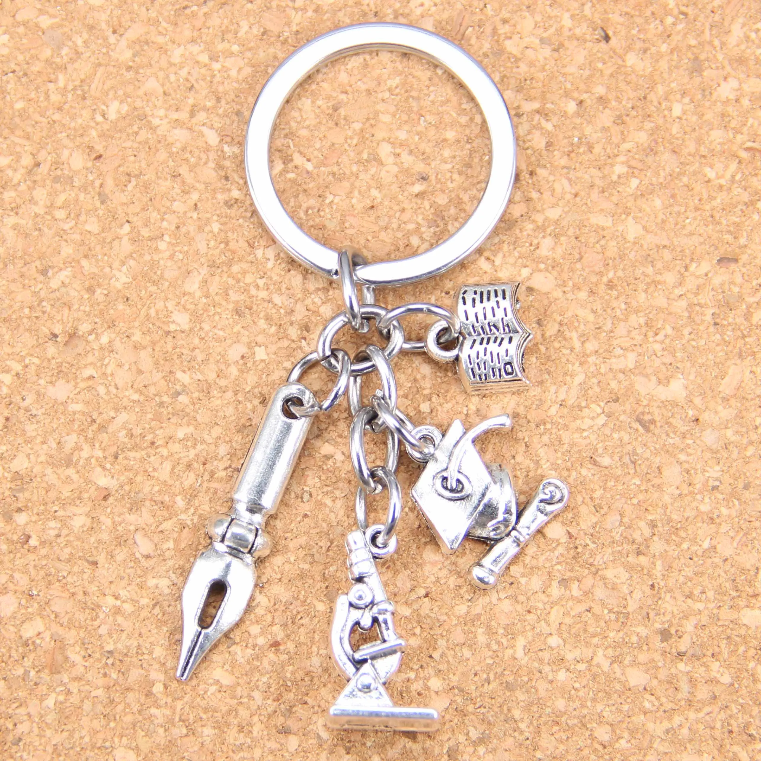 20pcs DIY Keychain graduation cap and diploma pen book ruler Pendants Men Jewelry Car Key Chain Souvenir For Teacher Gift
20pcs DIY Keychain graduation cap and diploma pen book ruler Pendants Men Jewelry Car Key Chain Souvenir For Teacher Gift