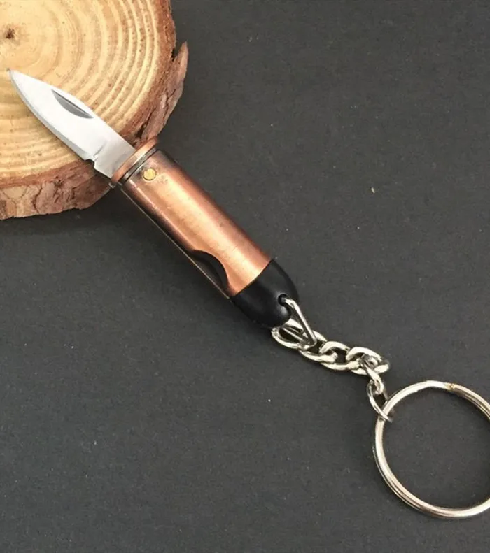 free shipping Carry a MINI pocket knife Small bullet shape gift key button creative knife
free shipping Carry a MINI pocket knife Small bullet shape gift key button creative knife