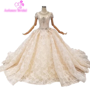 2019 Luxury Crystal Beaded Sequins Ball Gown Bridal Gown Dubai Robe Sexy Backless Sleeve Sheer Bridal Big Skirt Wedding Dresses
2019 Luxury Crystal Beaded Sequins Ball Gown Bridal Gown Dubai Robe Sexy Backless Sleeve Sheer Bridal Big Skirt Wedding Dresses